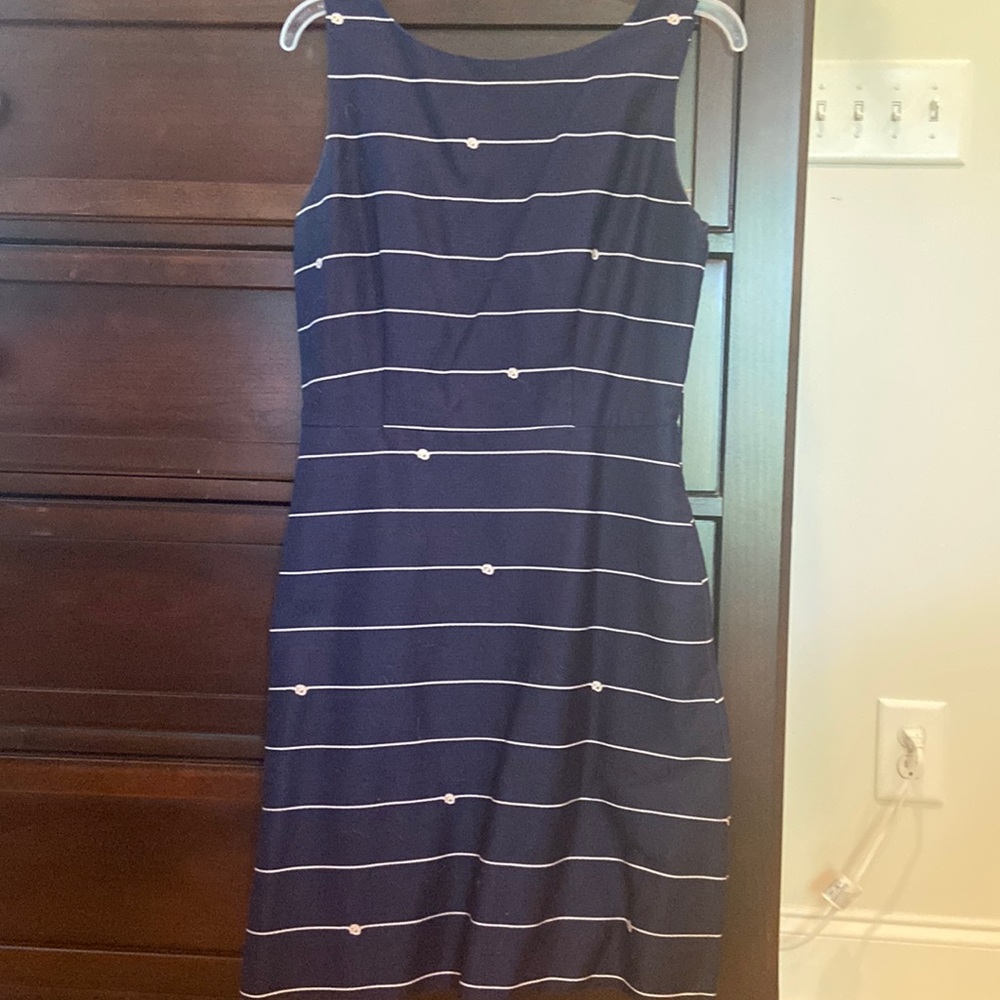 Navy/ cream dress with full skirt. Square neckline in back with zipper. Size 4.